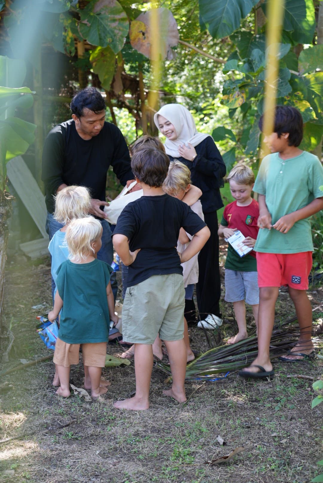 Selong Bay School staff spending time with students and the local Serangan community